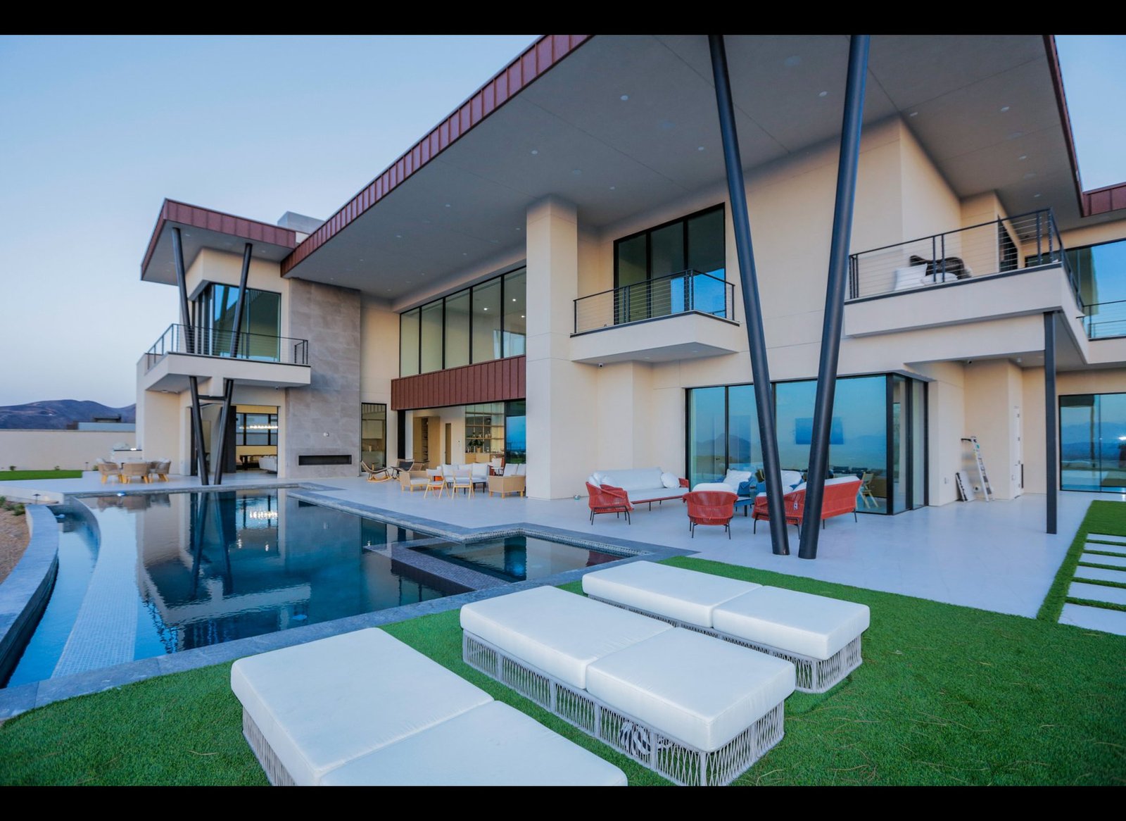 Private residence in Las Vegas at dusk seen across the pool