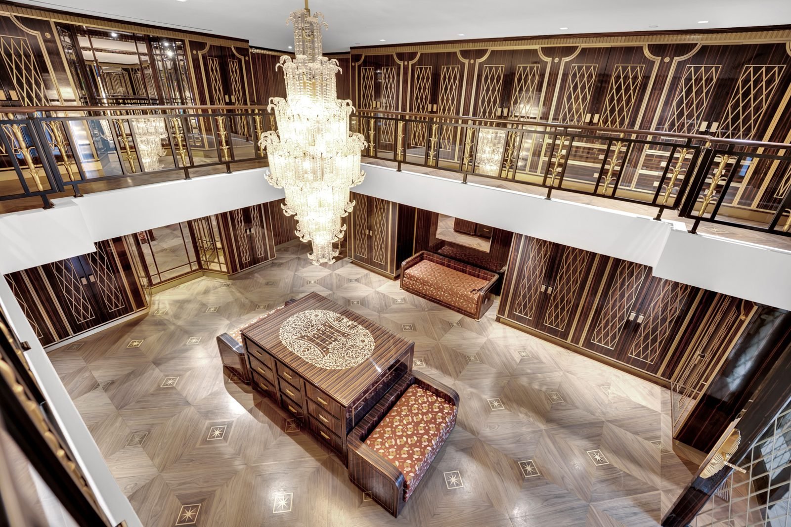 Two storey atrium with chandelier and gallery railings
