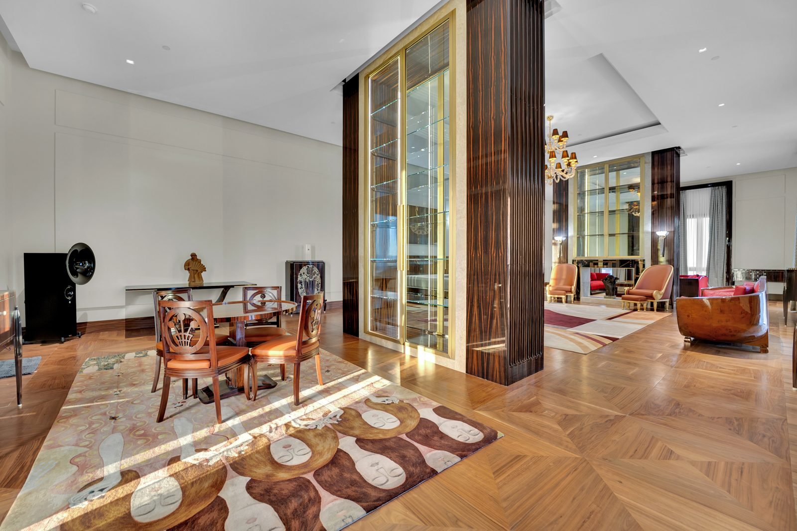 Dining area with walnut columns and gallery cabinetry