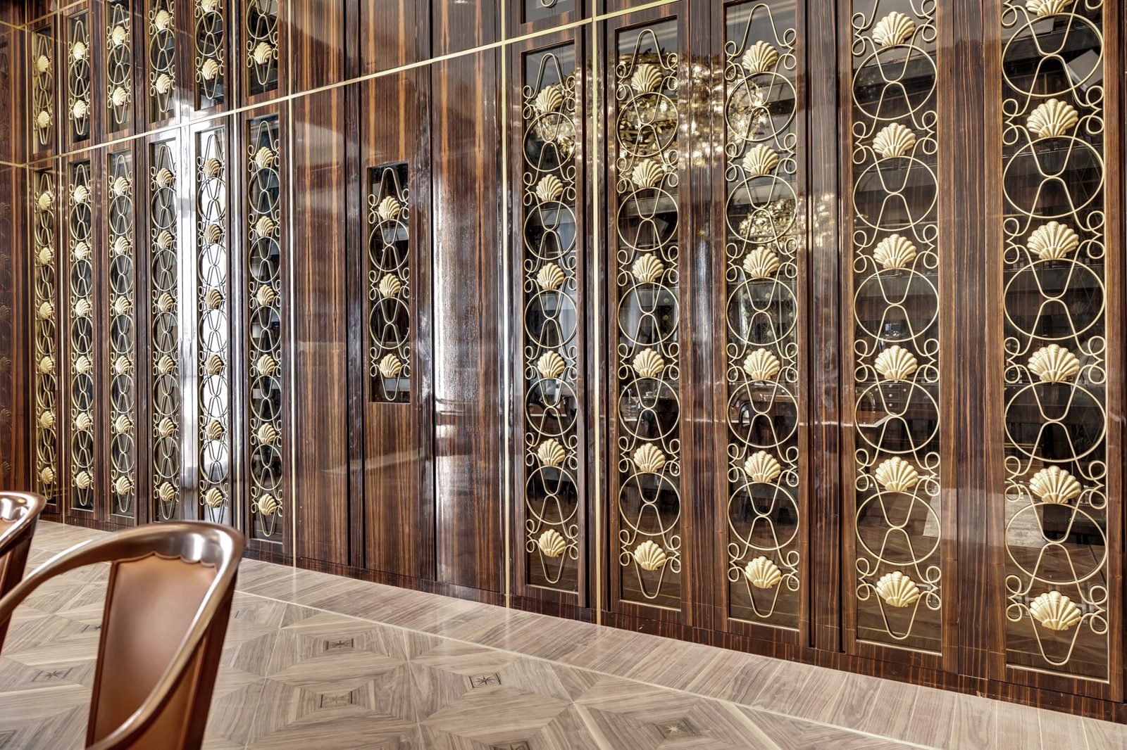 Bronze and walnut wine wall with decorative screens