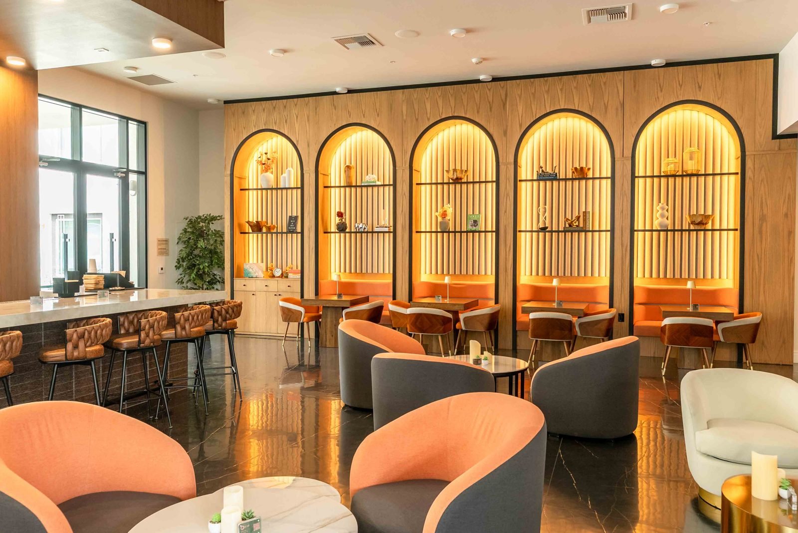 Otonomus lounge bar with arched backlit shelving
